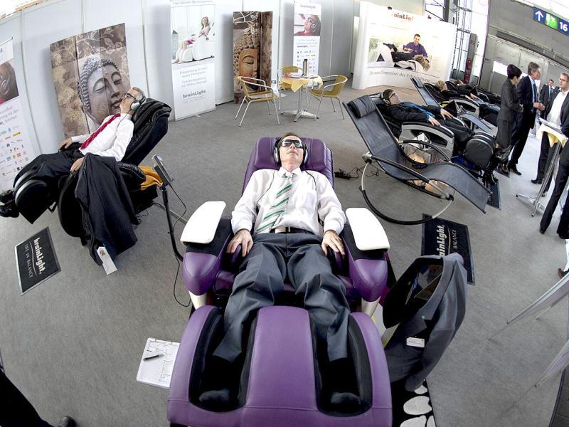 People get the 'brain light' treatment at the world's biggest high-tech fair, the CeBIT, on March 6, 2012 in Hanover, central Germany. Brazil is the partner country of the CeBIT 2012, which is running until March 10, 2012. The brain light is a massage chairs combined with light patterns and soothing sounds. AFP PHOTO / ODD ANDERSEN People get the 'brain light' treatment at the world's biggest high-tech fair, the CeBIT, on March 6, 2012 in Hanover, central Germany. Brazil is the partner country of the CeBIT 2012, which is running until March 10, 2012. The brain light is a massage chairs combined with light patterns and soothing sounds. AFP PHOTO / ODD ANDERSEN