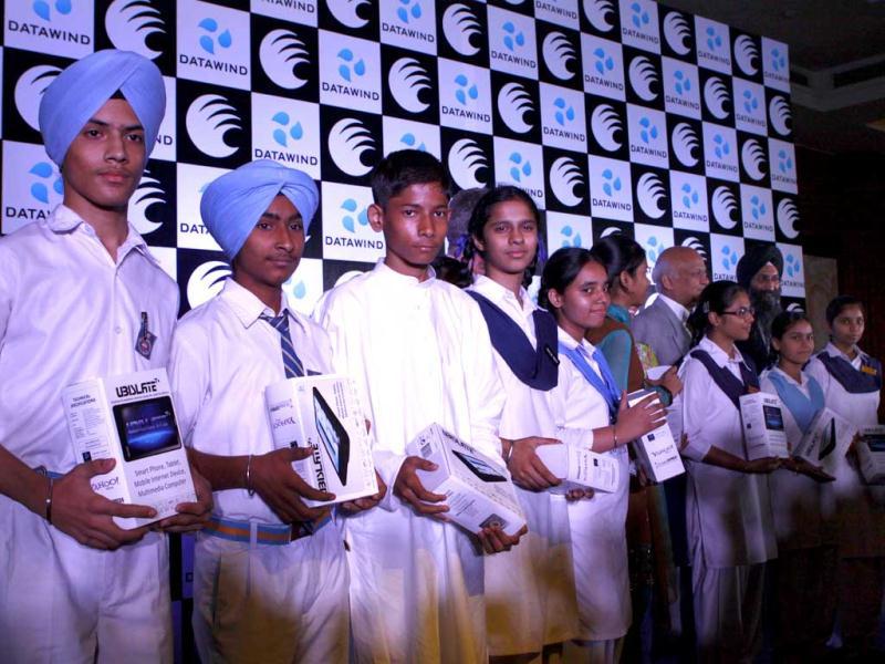 Sumeet Singh Tuli founder CEO of DataWind Ltd with students who have been given the 'Ubislate 7C', the world's cheapest tablet computer on its commercial launch in New Delhi. HT Photo/Vipin Kumar Sumeet Singh Tuli founder CEO of DataWind Ltd with students who have been given the 'Ubislate 7C', the world's cheapest tablet computer on its commercial launch in New Delhi. HT Photo/Vipin Kumar