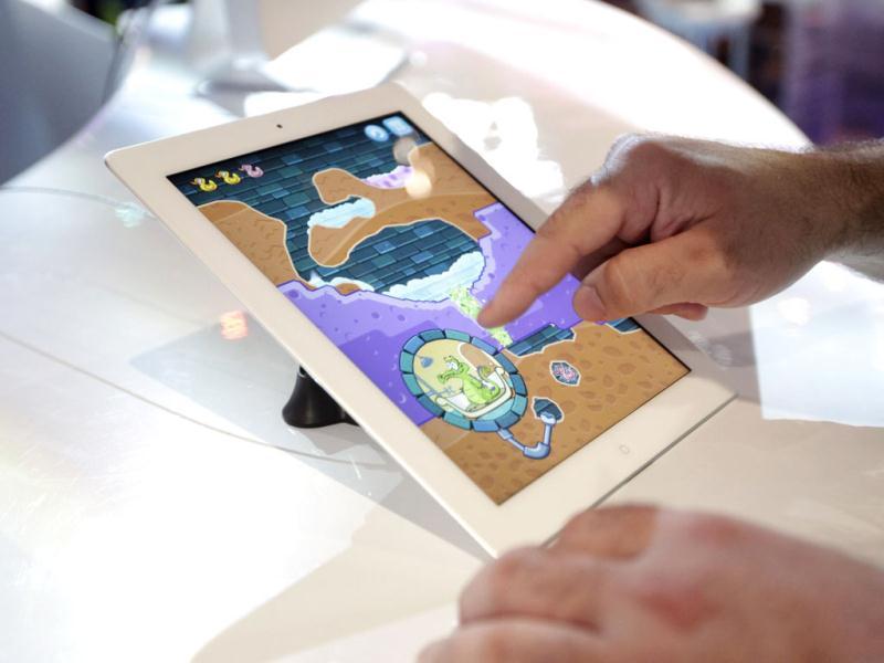 A show attendee plays a mobile app game 'Where's My Water' on an iPad at E3 2012 in Los Angeles. AP/Jae C. Hong A show attendee plays a mobile app game 'Where's My Water' on an iPad at E3 2012 in Los Angeles. AP/Jae C. Hong
