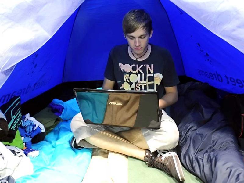 Sebastian works on his computer as he takes part in the Campus Party Europe electronic entertainment event in Berlin. The weeklong, 24-hours-a-day technology festival for thousands of “campuseros” - hackers, developers, gamers and geeks is running until August 26, 2012. Equipped with computers and other toys, participants camp on-site and immerse themselves in their technical environment. AFP PHOTO / BRITTA PEDERSEN Sebastian works on his computer as he takes part in the Campus Party Europe electronic entertainment event in Berlin. The weeklong, 24-hours-a-day technology festival for thousands of “campuseros” - hackers, developers, gamers and geeks is running until August 26, 2012. Equipped with computers and other toys, participants camp on-site and immerse themselves in their technical environment. AFP PHOTO / BRITTA PEDERSEN