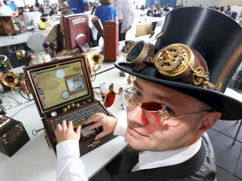 Inventor Sven Moeller works on his self-constructed computer during the Campus Party Europe electronic entertainment event in Berlin. The weeklong, 24-hours-a-day technology festival for thousands of “campuseros” - hackers, developers, gamers and geeks is running until August 26, 2012. Equipped with computers and other toys, participants camp on-site and immerse themselves in their technical environment. AFP PHOTO / STEPHANIE PILICK Inventor Sven Moeller works on his self-constructed computer during the Campus Party Europe electronic entertainment event in Berlin. The weeklong, 24-hours-a-day technology festival for thousands of “campuseros” - hackers, developers, gamers and geeks is running until August 26, 2012. Equipped with computers and other toys, participants camp on-site and immerse themselves in their technical environment. AFP PHOTO / STEPHANIE PILICK