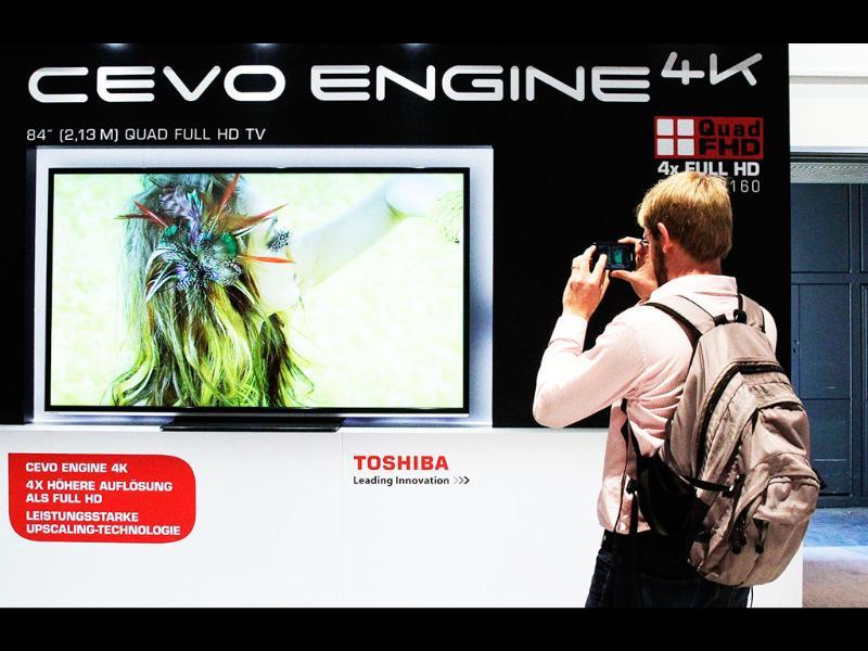 A man takes a picture of Toshiba's 4xFullHD television set at the IFA consumer electronics fair in Berlin, August 29, 2012. The IFA consumer electronics and home appliances fair will open its doors to the public from August 31 till September 5 in the German capital. Reuters/Tobias Schwarz A man takes a picture of Toshiba's 4xFullHD television set at the IFA consumer electronics fair in Berlin, August 29, 2012. The IFA consumer electronics and home appliances fair will open its doors to the public from August 31 till September 5 in the German capital. Reuters/Tobias Schwarz