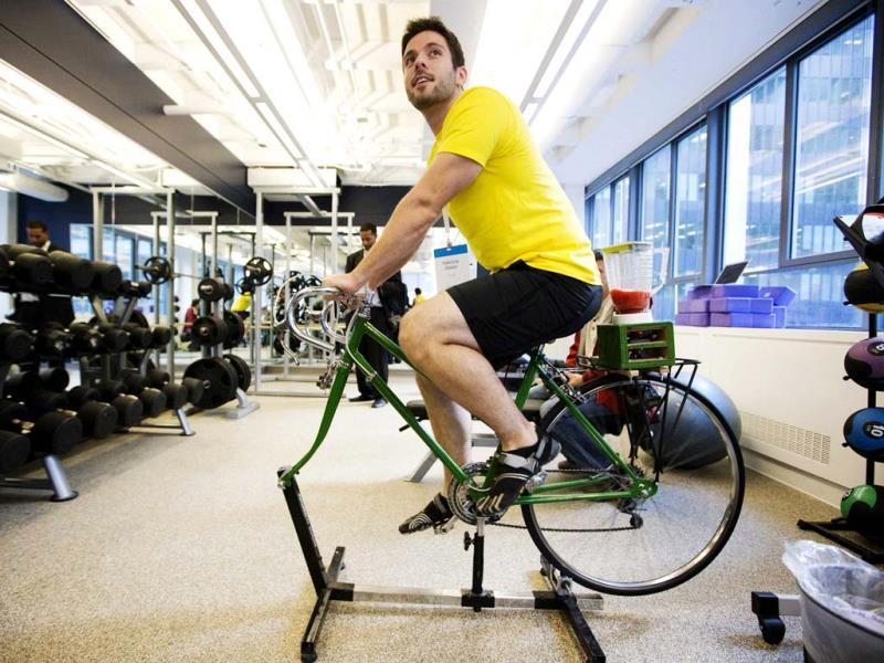 An employee demonstrates the use of an exercise cycle, that powers a blender making a fruit smoothie, inside the employee gym at the new Google office in Toronto, November 13, 2012. Reuters/Mark Blinch An employee demonstrates the use of an exercise cycle, that powers a blender making a fruit smoothie, inside the employee gym at the new Google office in Toronto, November 13, 2012. Reuters/Mark Blinch