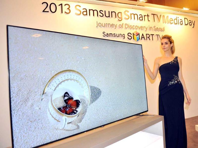 A model poses with a Samsung Electronics' new 75 inch F8000 Smart LED TV during a media conference in Seoul on February 19, 2013. South Korea's Samsung Electronics on February 19 launched a set of giant, Internet-enabled televisions aimed at boosting profit margins and cementing its lead on the world's TV markets hit by slowing global demand. Photo: AFP / Jung Yeon-Je A model poses with a Samsung Electronics' new 75 inch F8000 Smart LED TV during a media conference in Seoul on February 19, 2013. South Korea's Samsung Electronics on February 19 launched a set of giant, Internet-enabled televisions aimed at boosting profit margins and cementing its lead on the world's TV markets hit by slowing global demand. Photo: AFP / Jung Yeon-Je