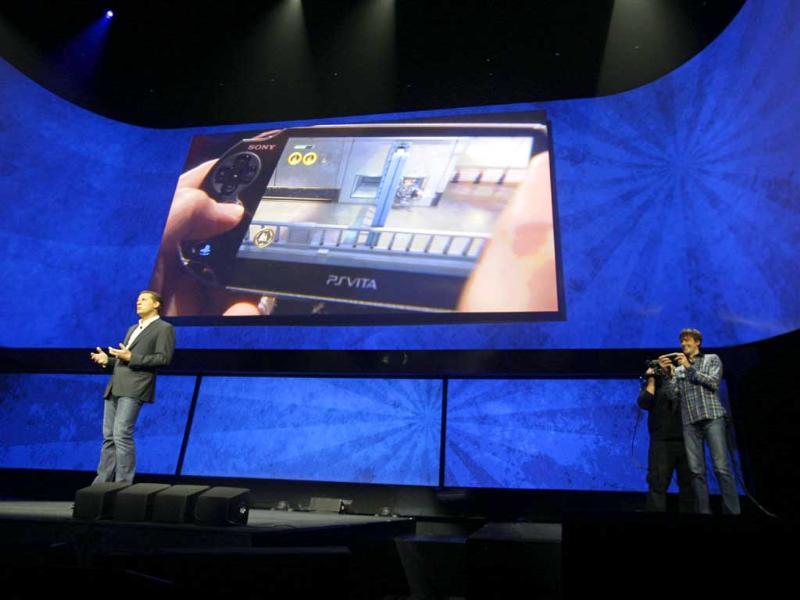 David Perry, CEO of Gaikai, left, speaks as Mark Cerny, demonstrates remote game play on the PSVita during a news conference to announce the Sony Playstation 4. Photo:AP/Frank Franklin II David Perry, CEO of Gaikai, left, speaks as Mark Cerny, demonstrates remote game play on the PSVita during a news conference to announce the Sony Playstation 4. Photo:AP/Frank Franklin II