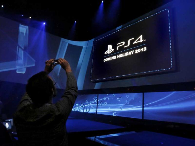 A man takes a picture at the PlayStation 4 launch event in New York. Reuters/Brendan McDermidd A man takes a picture at the PlayStation 4 launch event in New York. Reuters/Brendan McDermidd