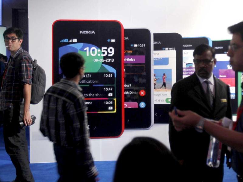 Visitors gather during the unveiling of Nokia's new $99 phone in its mid-range Asha line at a launch in New Delhi. (Reuters) Visitors gather during the unveiling of Nokia's new $99 phone in its mid-range Asha line at a launch in New Delhi. (Reuters)
