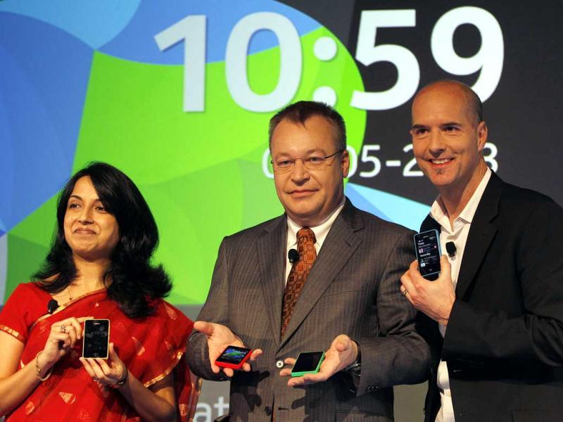 Nokia's chief executive officer Stephen Elop, center, head developer Sangeeta Bavi, left, and design head Peter Skillman display Nokia Asha 501 smartphones during its launch in New Delhi. (AP) Nokia's chief executive officer Stephen Elop, center, head developer Sangeeta Bavi, left, and design head Peter Skillman display Nokia Asha 501 smartphones during its launch in New Delhi. (AP)