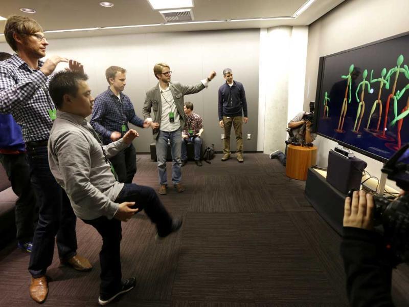 A group of visiting journalists try out the improved motion-detecting capabilities of the new Kinect controller for Microsoft's next-generation Xbox One entertainment and gaming console system. Photo: AP/Ted S. Warren A group of visiting journalists try out the improved motion-detecting capabilities of the new Kinect controller for Microsoft's next-generation Xbox One entertainment and gaming console system. Photo: AP/Ted S. Warren