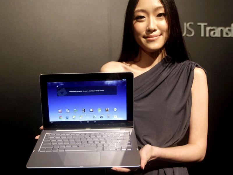Asustek's new product ASUS Transformer Book Trio, an 11.6-inch device combined notbook, tablet and desktop, is displayed during a news conference as part of media preview of the 2013 Computex exhibition in Taipei. Reuters/Pichi Chuang Asustek's new product ASUS Transformer Book Trio, an 11.6-inch device combined notbook, tablet and desktop, is displayed during a news conference as part of media preview of the 2013 Computex exhibition in Taipei. Reuters/Pichi Chuang
