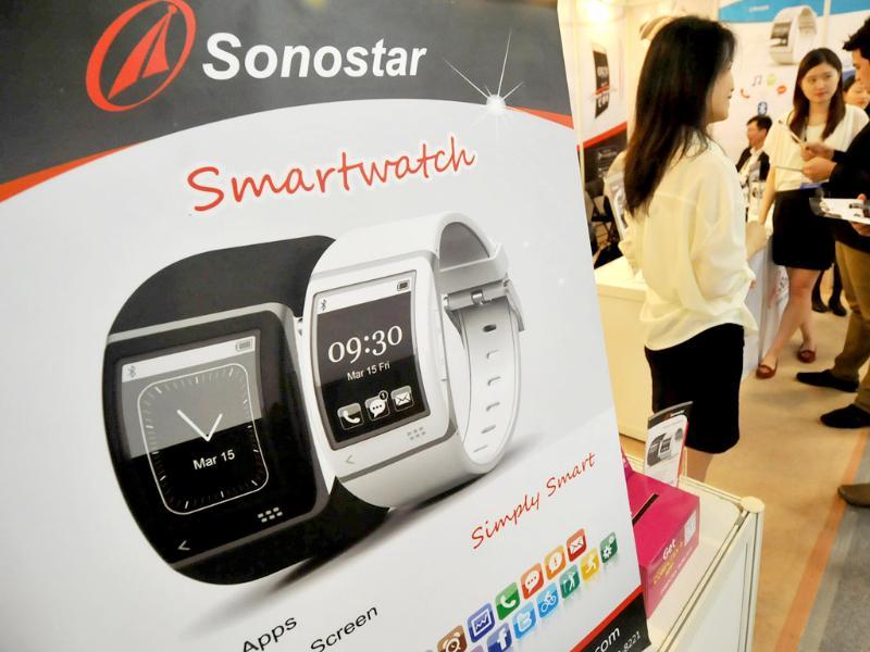 Staffs introduce smartwatch, developed by Sonostar, a Taiwanese golf GPS data base provider, to visitors during the 2013 Computex in Taipei . Photo: AFP / Mandy Cheng Staffs introduce smartwatch, developed by Sonostar, a Taiwanese golf GPS data base provider, to visitors during the 2013 Computex in Taipei . Photo: AFP / Mandy Cheng