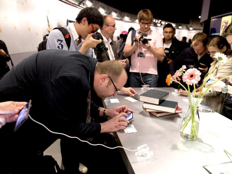 Journalists take a look at the new Huawei Ascend P6 smartphone during the global launch in London. Photo: AFP / Justin Tallis Journalists take a look at the new Huawei Ascend P6 smartphone during the global launch in London. Photo: AFP / Justin Tallis