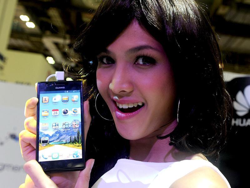 A promoter displays Huwei's Ascend P2 Android smartphone at the CommunicAsia2013 exhibition show in Singapore. CommunicAsia is one of the region leading expo on mobile and broadcast communications. Photo: AFP/Roslan Rahman A promoter displays Huwei's Ascend P2 Android smartphone at the CommunicAsia2013 exhibition show in Singapore. CommunicAsia is one of the region leading expo on mobile and broadcast communications. Photo: AFP/Roslan Rahman