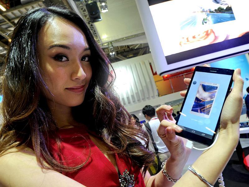 A promoter displays Huwei Ascend Mate Android smartphone at the CommunicAsia2013 exhibition show in Singapore. CommunicAsia is one of the region leading expo on mobile and broadcast communications. Photo: AFP/Roslan Rahman A promoter displays Huwei Ascend Mate Android smartphone at the CommunicAsia2013 exhibition show in Singapore. CommunicAsia is one of the region leading expo on mobile and broadcast communications. Photo: AFP/Roslan Rahman