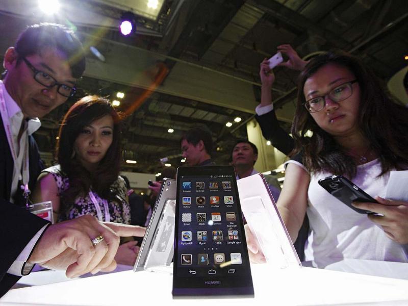 Visitors try out the Huawei Ascend P6 Android-based smartphones during their launch at the CommunicAsia communication and information technology exhibition in Singapore. Reuters/Edgar Su Visitors try out the Huawei Ascend P6 Android-based smartphones during their launch at the CommunicAsia communication and information technology exhibition in Singapore. Reuters/Edgar Su
