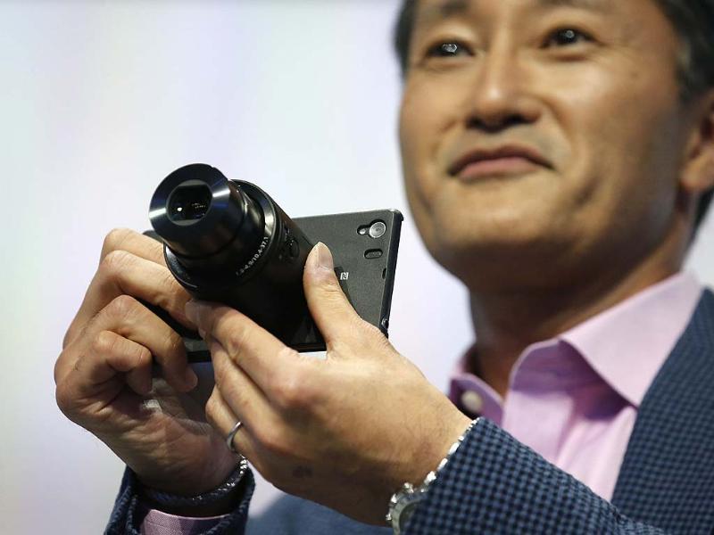 A Sony staff member introduces the attachable lens during a media preview of the new Sony Xperia Z1 smartphone during it's world premier at the IFA consumer electronics fair in Berlin. Photo: Reuters/Fabrizio Bensch A Sony staff member introduces the attachable lens during a media preview of the new Sony Xperia Z1 smartphone during it's world premier at the IFA consumer electronics fair in Berlin. Photo: Reuters/Fabrizio Bensch