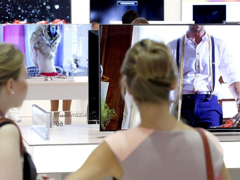 Visitors look at Samsung Ultra HD TV screens at the IFA, one of the world's largest trade fairs for consumer electronics and electrical home appliances in Berlin, Germany. Photo: AP/Michael Sohn Visitors look at Samsung Ultra HD TV screens at the IFA, one of the world's largest trade fairs for consumer electronics and electrical home appliances in Berlin, Germany. Photo: AP/Michael Sohn