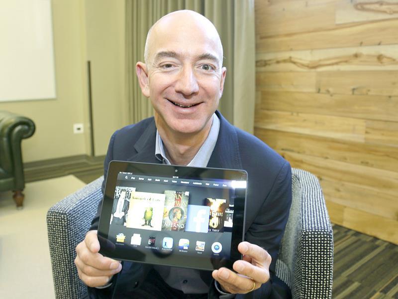 Jeff Bezos, CEO of Amazon.com, poses for a photo with the 8.9-inch version of the new Amazon Kindle HDX tablet computer in Seattle. Photo: AP/Ted S. Warren Jeff Bezos, CEO of Amazon.com, poses for a photo with the 8.9-inch version of the new Amazon Kindle HDX tablet computer in Seattle. Photo: AP/Ted S. Warren