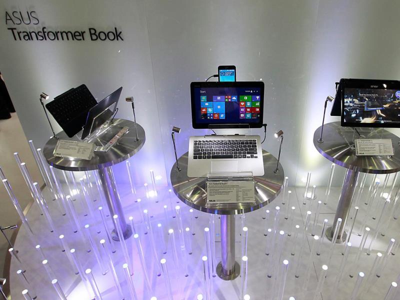 New ASUSTeK products, Transformer Book T300 Chi (L), Transformer Book V (C) and Transformer Book Flip, are displayed at the ASUSTeK booth during the 2014 Computex exhibition at the TWTC Nangang exhibition hall in Taipei. Photo: Reuters/Pichi Chuang New ASUSTeK products, Transformer Book T300 Chi (L), Transformer Book V (C) and Transformer Book Flip, are displayed at the ASUSTeK booth during the 2014 Computex exhibition at the TWTC Nangang exhibition hall in Taipei. Photo: Reuters/Pichi Chuang