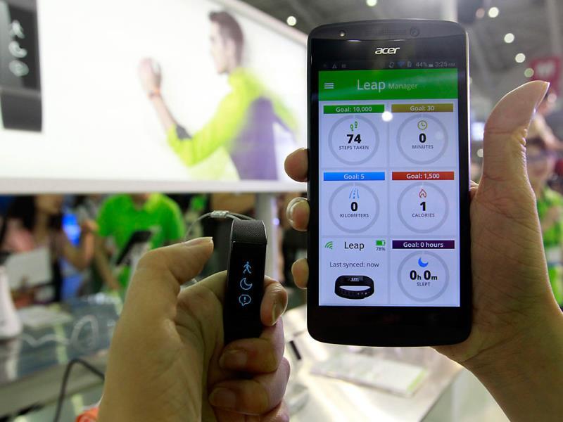 Acer's wearable device Liquid Leap (L) and Liquid Jade smartphone are displayed during the 2014 Computex exhibition at the TWTC Nangang exhibition hall in Taipei . Reuters/Pichi Chuang Acer's wearable device Liquid Leap (L) and Liquid Jade smartphone are displayed during the 2014 Computex exhibition at the TWTC Nangang exhibition hall in Taipei . Reuters/Pichi Chuang