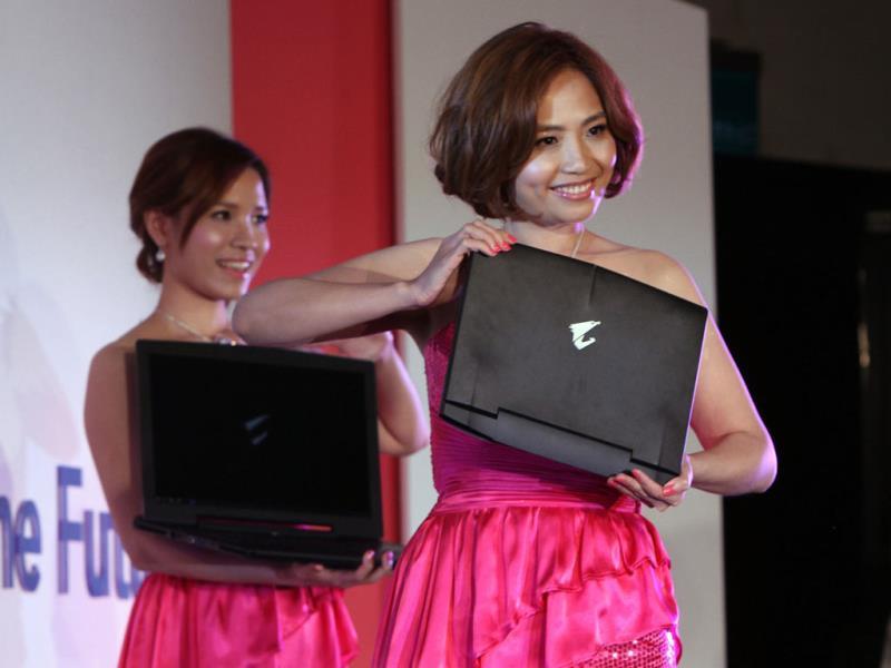 A model displays Gigabyte's AORUS X3 Plus 13.9' GTX870M Gaming Notebook during a press event on the eve of the Computex Taipei. Photo: AP/Chiang Ying-ying A model displays Gigabyte's AORUS X3 Plus 13.9' GTX870M Gaming Notebook during a press event on the eve of the Computex Taipei. Photo: AP/Chiang Ying-ying