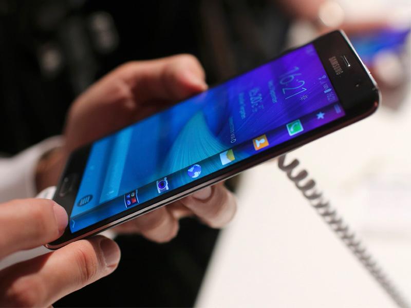 A visitor holds a new Samsung Galaxy Note Edge smartphone after its presentation at the Unpacked 2014 Episode 2 event in Berlin. (Reuters/Hannibal Hanschke) A visitor holds a new Samsung Galaxy Note Edge smartphone after its presentation at the Unpacked 2014 Episode 2 event in Berlin. (Reuters/Hannibal Hanschke)