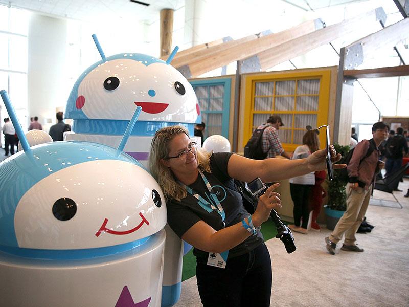 An attendee takes a selfie in front of Android mascots during the 2015 Google I/O conference in San Francisco, California. Photo: AFP / Justin Sullivan An attendee takes a selfie in front of Android mascots during the 2015 Google I/O conference in San Francisco, California. Photo: AFP / Justin Sullivan
