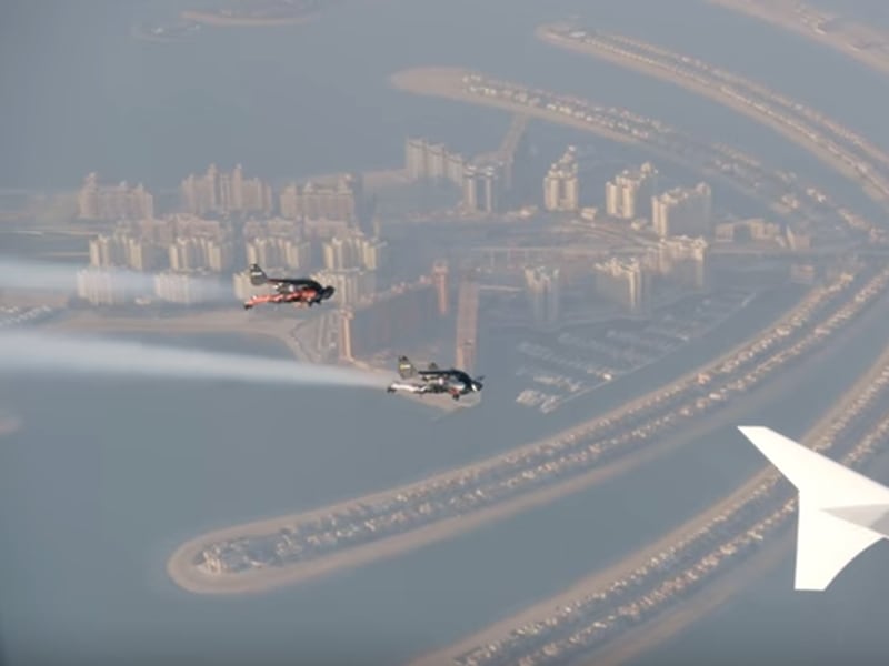 Watch Two Men in Jetpacks Fly Alongside a Jumbo Jet Over Dubai