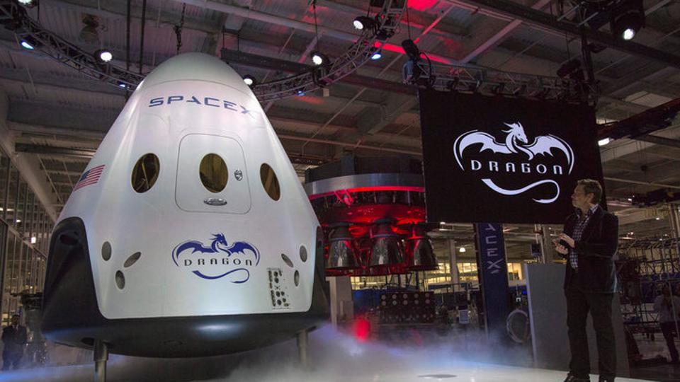 SpaceX CEO Elon Musk unveils the Dragon V2 spacecraft in Hawthorne, California on May 29, 2014 SpaceX CEO Elon Musk unveils the Dragon V2 spacecraft in Hawthorne, California on May 29, 2014