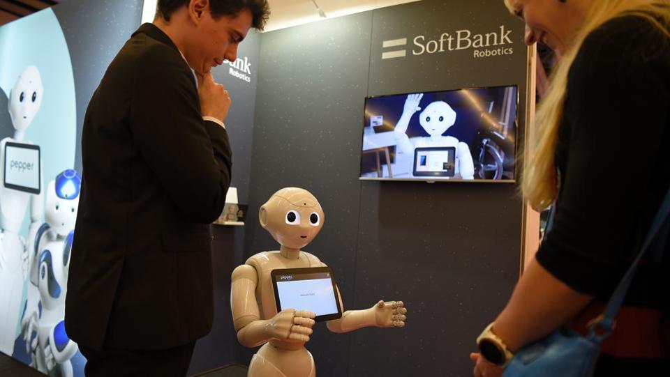 The robot ‘Pepper’ interacts with visitors at the SoftBank Robotics stand (AFP) The robot ‘Pepper’ interacts with visitors at the SoftBank Robotics stand (AFP)