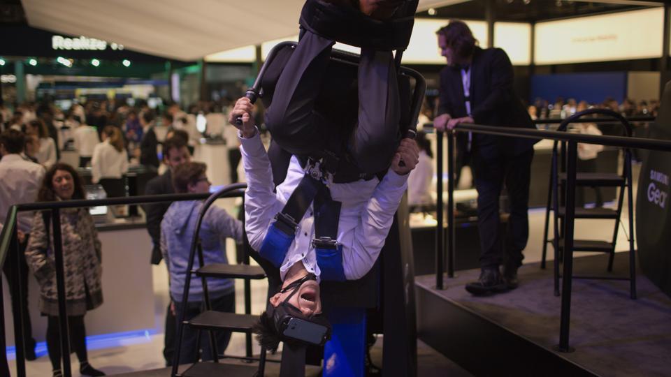 A visitor enjoys a Samsung VR virtual reality experience (AP) A visitor enjoys a Samsung VR virtual reality experience (AP)