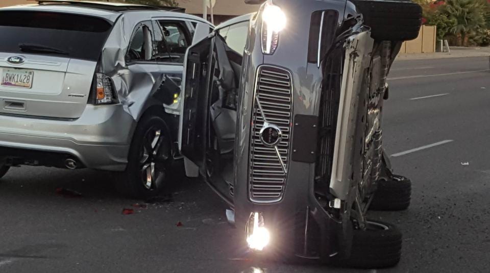 A self-driven Volvo SUV owned and operated by Uber Technologies Inc. is flipped on its side after a collision in Tempe, Arizona, U.S.