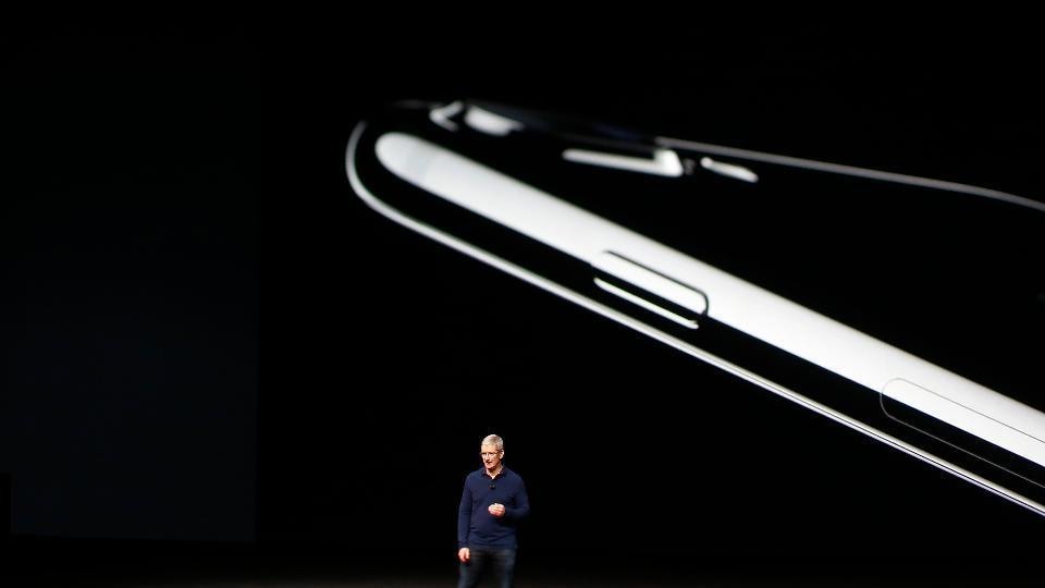 The picture shows Apple CEO Tim Cook unveiling the iPhone 7 and iPhone 7 Plus at the Bill Graham Civic Auditorium in San Francisco.