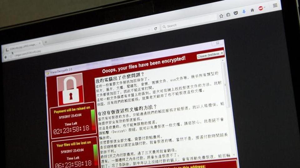 A screenshot of the warning screen from a purported ransomware attack, as captured by a computer user in Taiwan, is seen on laptop in Beijing.