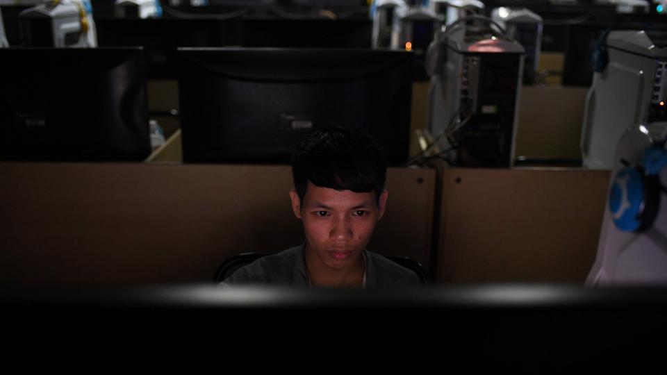 A worker in an internet cafe at the Huajian shoe factory in Dongguan, in south China's Guangdong province.