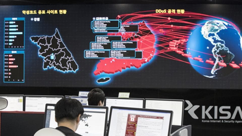 In this Monday, May 15, 2017, file photo, employees watch electronic boards monitoring possible ransomware cyberattacks at the Korea Internet and Security Agency in Seoul, South Korea.