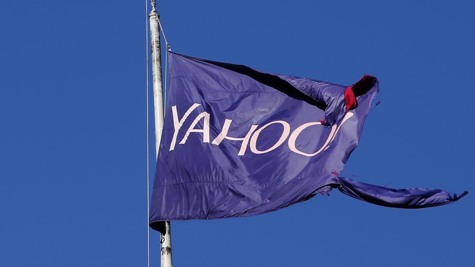 A tattered flag bearing the Yahoo company logo flies above a building in New York.