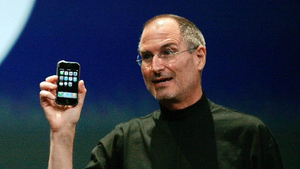 Then Apple Chief Executive Officer Steve Jobs holds the new iPhone in San Francisco, California January 9, 2007.