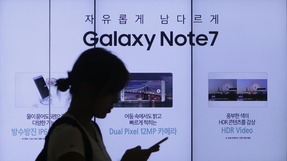 A woman walks by an advertisement of Samsung Electronics' Galaxy Note 7 smartphone at the company's showroom in Seoul, South Korea.