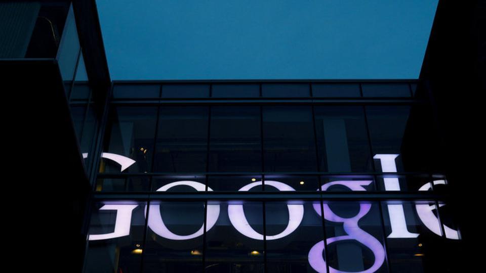 The sign marking the Google offices is lit up in Cambridge, Massachusetts, US, on June 27, 2017.