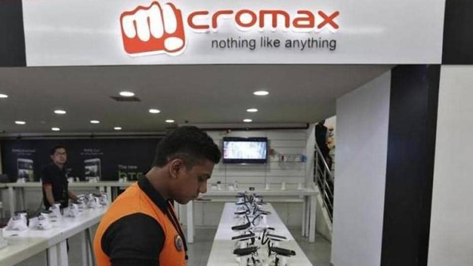 An employee stands at the counter of Micromax mobile phones at a showroom in New Delhi. Photo: Reuters