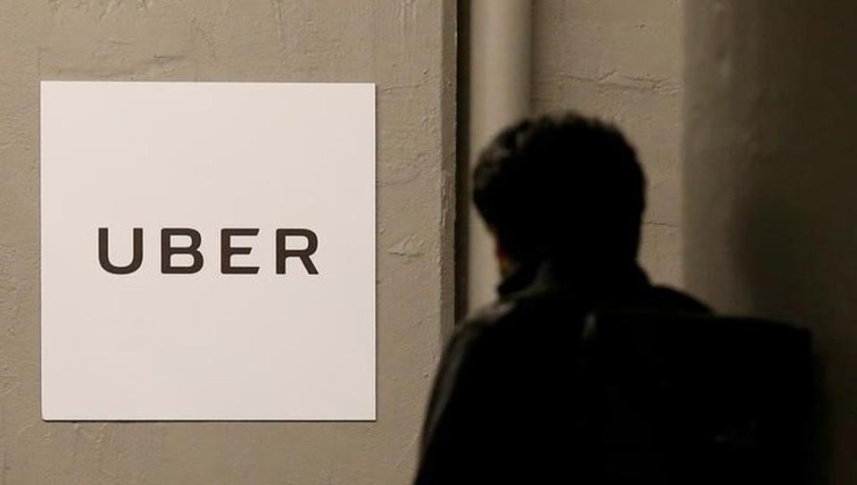 A man arrives at the Uber offices in US.