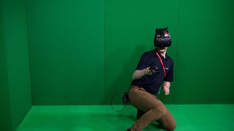 A visitor uses a VR device during the Mobile World Congress on the third day of the MWC in Barcelona, on March 1, 2017.