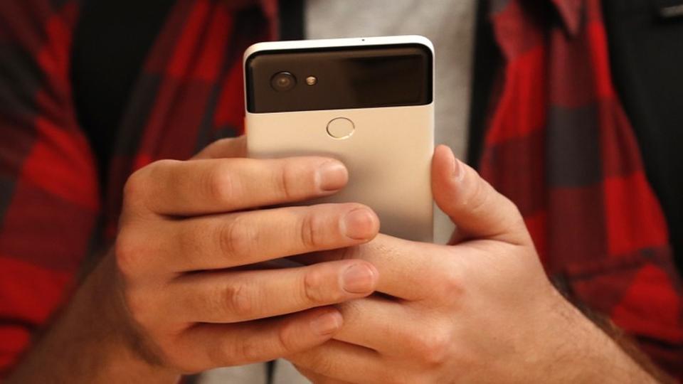 People try out Google's Pixel 2 phones during a launch event in San Francisco, California, U.S. October 4, 2017. REUTERS/Stephen Lam