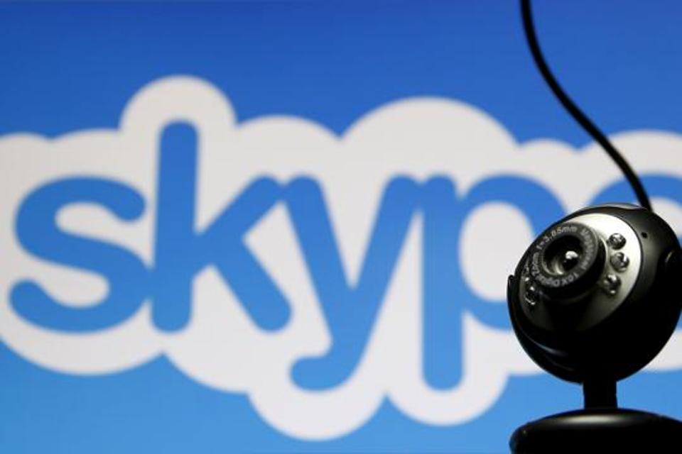 FILE PHOTO: A web camera is seen in front of a Skype logo in this photo illustration May 26, 2015.