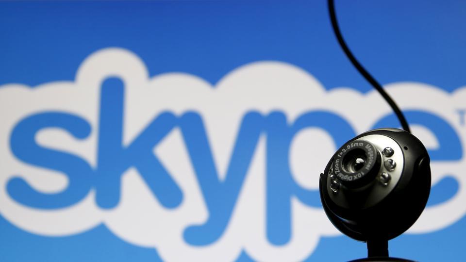 FILE PHOTO: A web camera is seen in front of a Skype logo in this photo illustration May 26, 2015. REUTERS/Dado Ruvic/File Photo