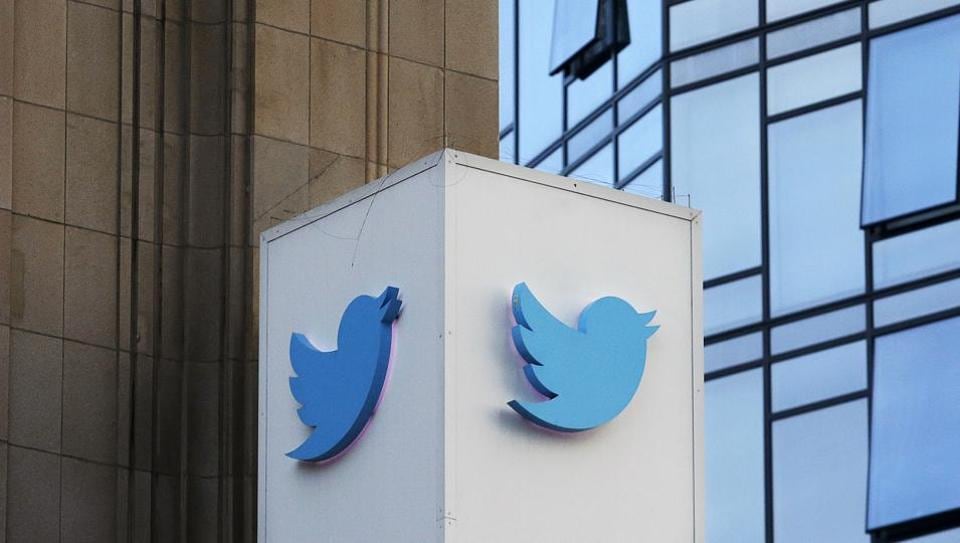A Twitter sign outside the company's headquarters in San Francisco. Twitter will be enforcing stricter policies on violent and abusive content.