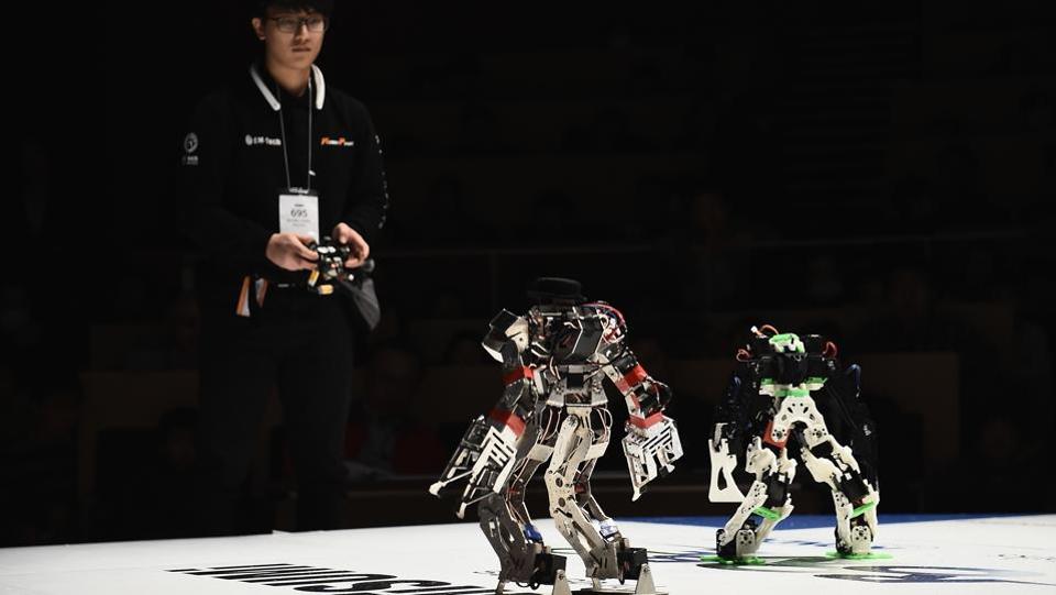 There is no wall or arena for the robots to compete in, so competitors have to build machines with all the necessary sensors to keep their bots in the designated spaces. (Matt Roberts / Getty Images) Robots
