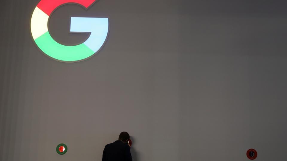 A man checks Google devices outside its booth at the Mobile World Congress in Barcelona, Spain, on February 27, 2018. The tech giant is being sued for discrimination in its hiring policy.