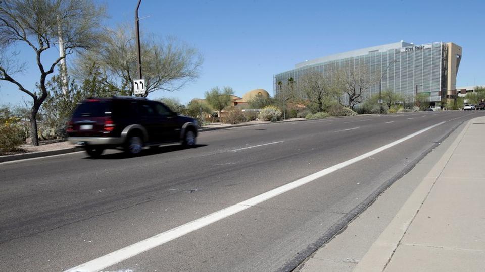 Burned out flares lie at the location where a woman pedestrian was struck and killed by an Uber self-driving sport utility vehicle in Tempe, Arizona, U.S., March 19, 2018.